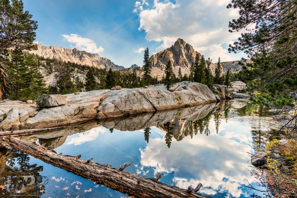 Mountain peak reflection, Sabrina Basin in the John Muir Wilderness, CA. After passing Blue Lake, Carolita and I came upon a small pool of water that was protected from the wind. It provided the perfect reflecting pool for the nearby mountain peaks and clouds. It's these small, hidden gems that I love to photograph, more so than the standard photographer favorites.